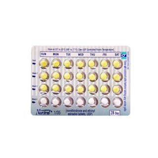 A blister pack of Nortrel birth control pills, labeled with days of the week and numbered rows for a 28-day cycle.