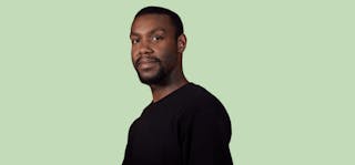 man and green background