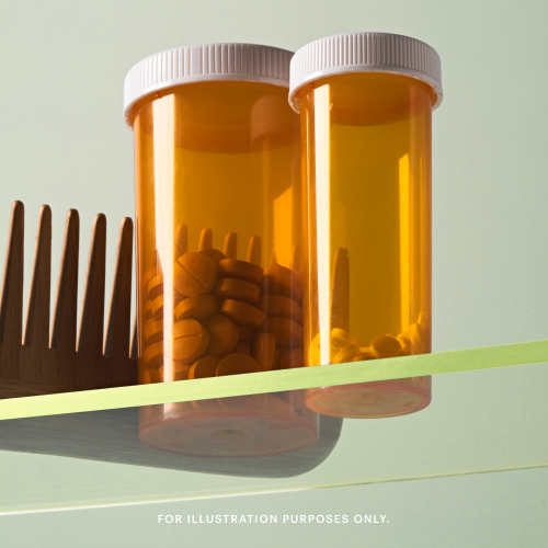 Two orange pill bottles with white caps, one containing several pills, are shown against a light background. A wooden comb is partially visible on the left.