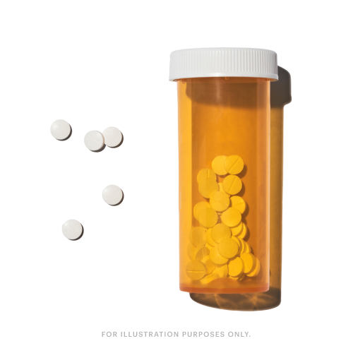 An orange pill bottle with white cap, containing yellow pills. Five white pills are scattered beside it. Text reads: 