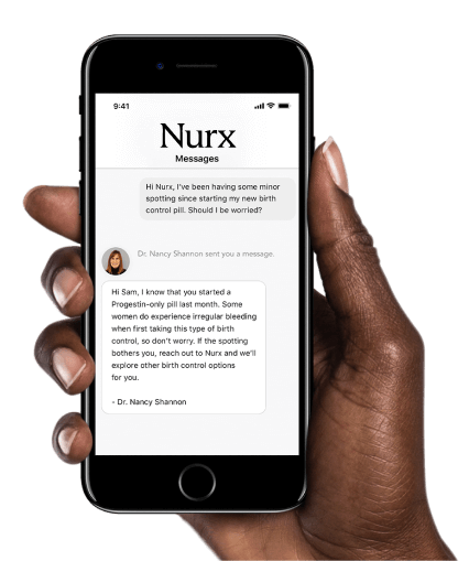 Hand holding a smartphone displaying a conversation about birth control pill concerns between a user and Dr. Nancy Shannon on the Nurx app.