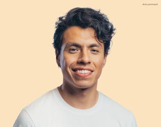 A smiling person with dark hair and a white shirt stands against a light peach background, embodying confidence and health. In the corner, text reads 