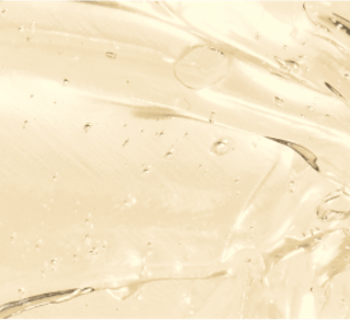 Close-up of a smooth, translucent gel infused with tretinoin cream, featuring scattered air bubbles on a light background.